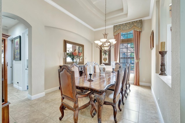 16211 Rosecroft Ter, Delray Beach, FL 33446 - dining space with light tile patterned floors, arched walkways, a tray ceiling, and a notable chandelier
