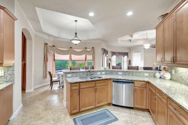 16211 Rosecroft Ter, Delray Beach, FL 33446 - kitchen with a sink, tasteful backsplash, a tray ceiling, and dishwasher