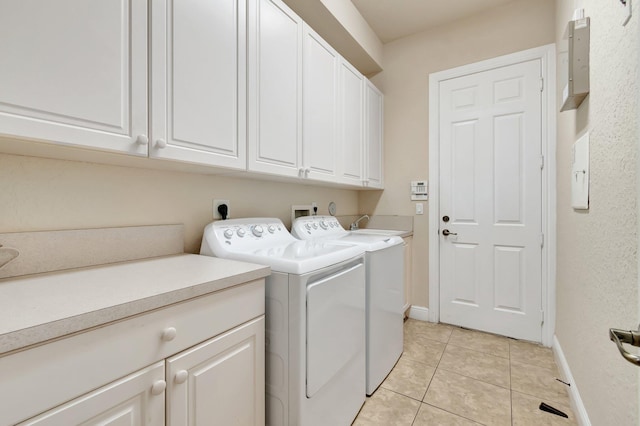16211 Rosecroft Ter, Delray Beach, FL 33446 - laundry area with baseboards, light tile patterned flooring, cabinet space, and washer and clothes dryer