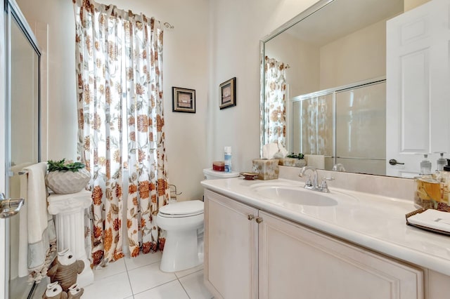 16211 Rosecroft Ter, Delray Beach, FL 33446 - bathroom featuring vanity, tile patterned flooring, a shower with door, and toilet