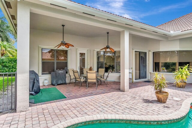 16211 Rosecroft Ter, Delray Beach, FL 33446 - view of patio with area for grilling, ceiling fan, and outdoor dining space