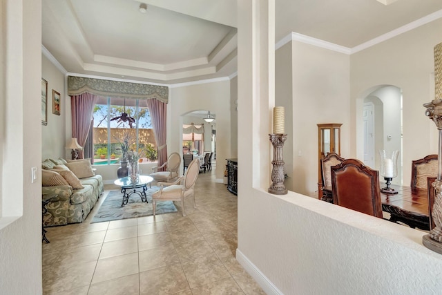 16211 Rosecroft Ter, Delray Beach, FL 33446 - living room with a ceiling fan, arched walkways, light tile patterned floors, a raised ceiling, and ornamental molding