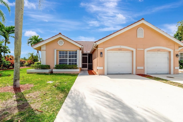 6493 Marissa Cir, Lake Worth, FL 33467 - single story home featuring stucco siding, a tiled roof, a front yard, concrete driveway, and an attached garage