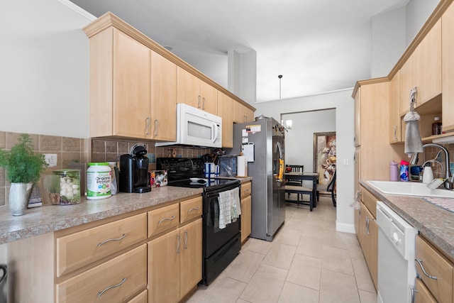 kitchen with a sink, light brown cabinets, white appliances, decorative backsplash, and light tile patterned floors