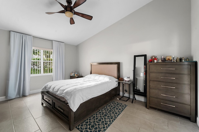 bedroom featuring ceiling fan, baseboards, vaulted ceiling, and light tile patterned floors