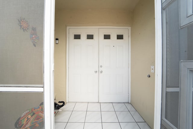 doorway to property with stucco siding
