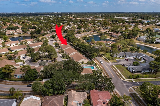 bird's eye view with a water view and a residential view
