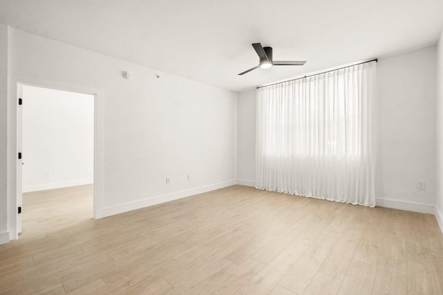 720 S Sapodilla Ave Unit 105, West Palm Beach, FL 33401 - unfurnished room with a ceiling fan, light wood finished floors, and baseboards