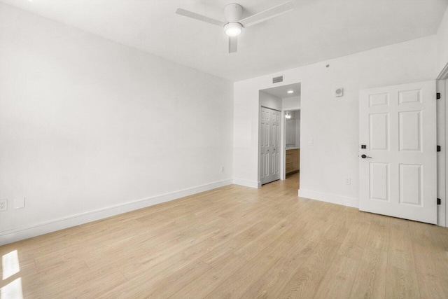 720 S Sapodilla Ave Unit 105, West Palm Beach, FL 33401 - unfurnished room featuring baseboards, light wood-type flooring, and ceiling fan