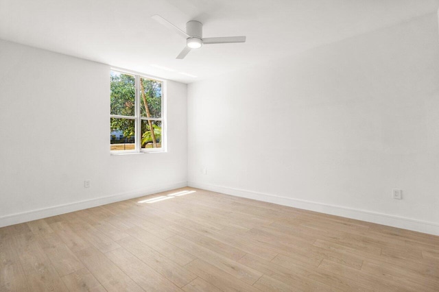 720 S Sapodilla Ave Unit 105, West Palm Beach, FL 33401 - spare room featuring light wood finished floors, a ceiling fan, and baseboards