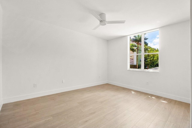 720 S Sapodilla Ave Unit 105, West Palm Beach, FL 33401 - empty room with light wood finished floors, ceiling fan, and baseboards