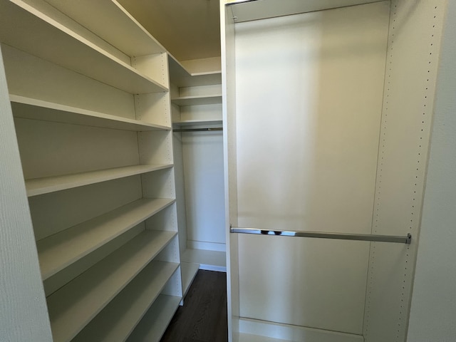 720 S Sapodilla Ave Unit 105, West Palm Beach, FL 33401 - walk in closet featuring dark wood finished floors