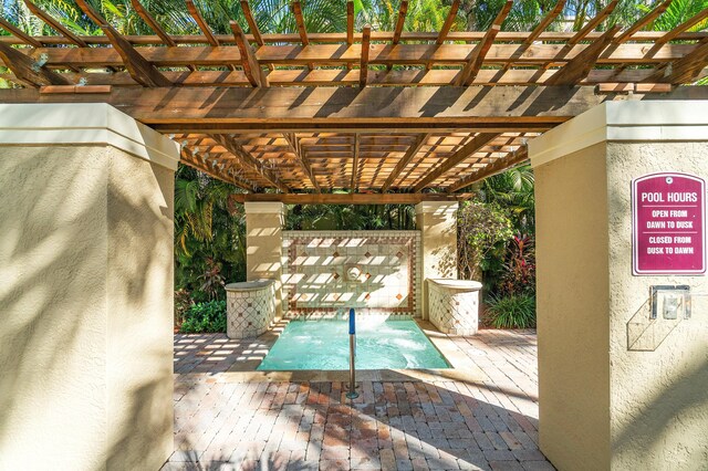 720 S Sapodilla Ave Unit 105, West Palm Beach, FL 33401 - view of pool with a pergola and a patio
