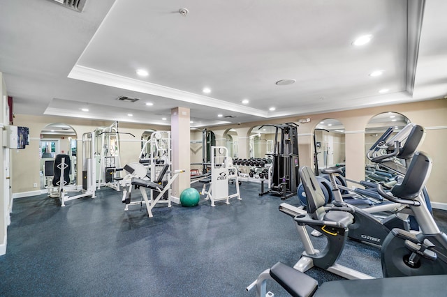 720 S Sapodilla Ave Unit 105, West Palm Beach, FL 33401 - gym featuring a raised ceiling, crown molding, arched walkways, baseboards, and recessed lighting