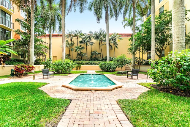 720 S Sapodilla Ave Unit 105, West Palm Beach, FL 33401 - view of swimming pool with a lawn