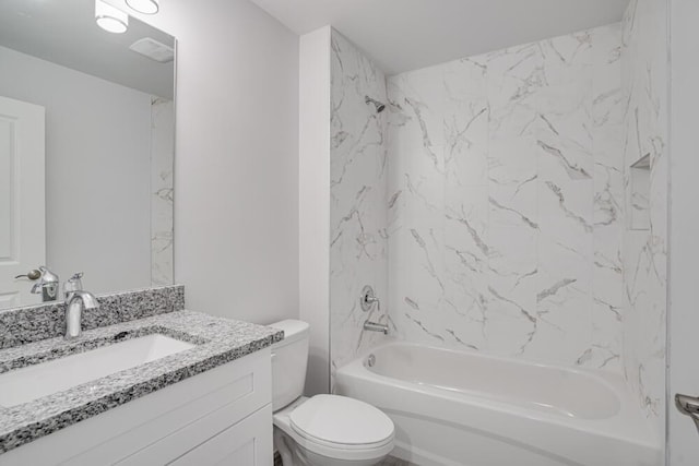 bathroom with tub / shower combination, toilet, and vanity