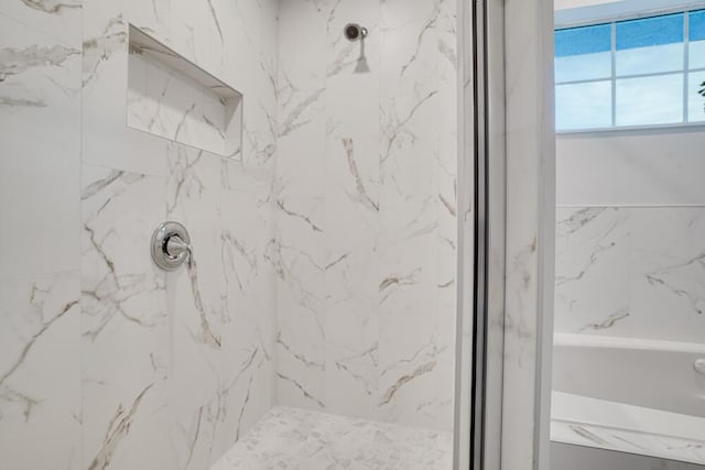 full bathroom with a marble finish shower