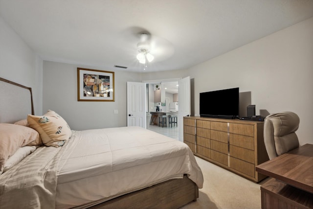 bedroom featuring light colored carpet and visible vents