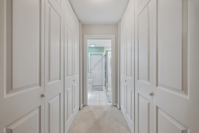 hall with light carpet