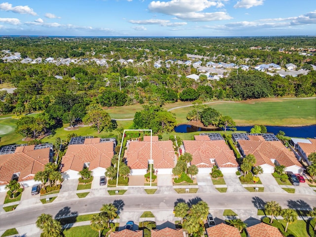 bird's eye view with a water view, golf course view, and a residential view