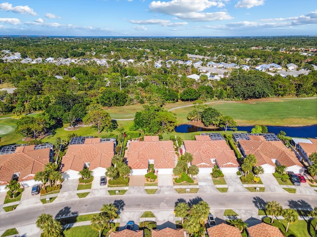 bird's eye view with a water view, golf course view, and a residential view