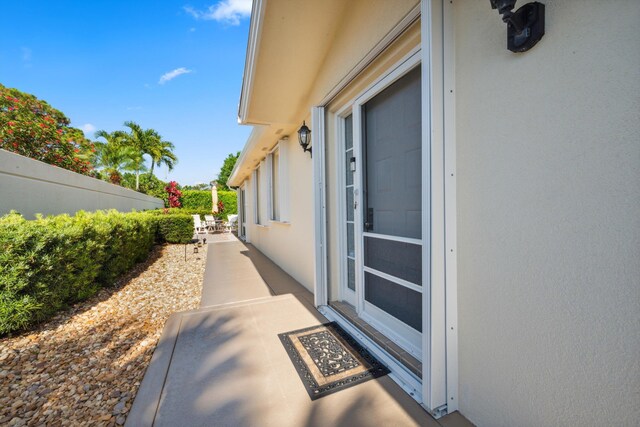 exterior space with a patio and stucco siding