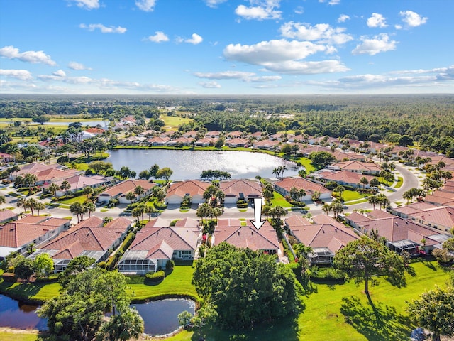 drone / aerial view featuring a water view and a residential view