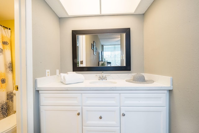 bathroom with vanity and curtained shower