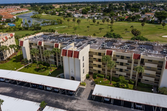 drone / aerial view featuring a water view and golf course view