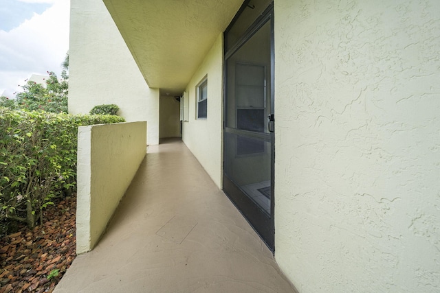 exterior space featuring stucco siding and a balcony