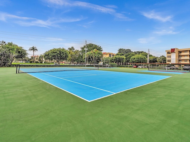 view of sport court with fence