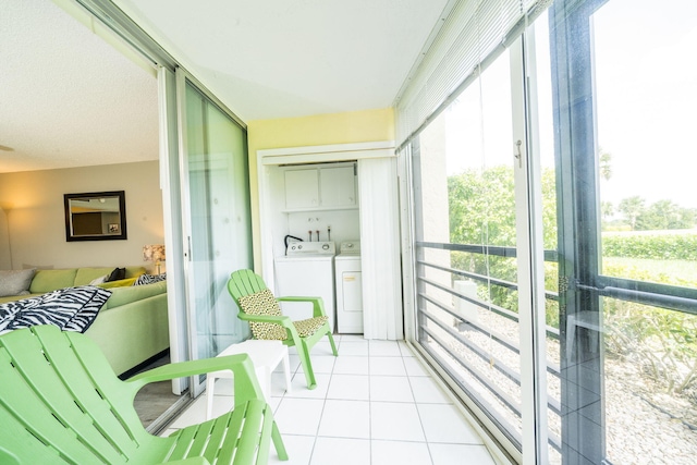 sunroom featuring washer and dryer
