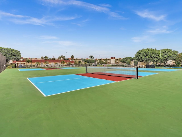 view of tennis court with fence and community basketball court