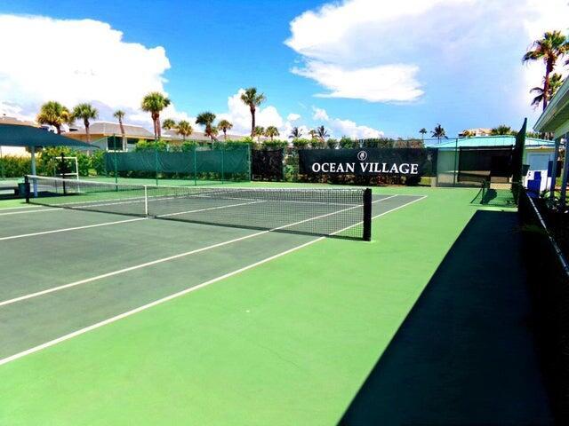 view of sport court with fence