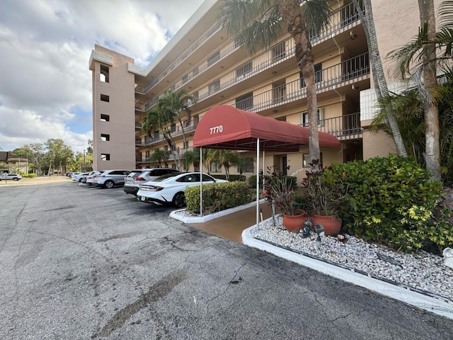 view of property with uncovered parking