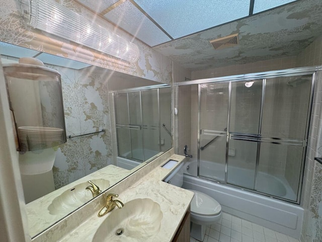 bathroom with tile patterned floors, toilet, combined bath / shower with glass door, visible vents, and wallpapered walls