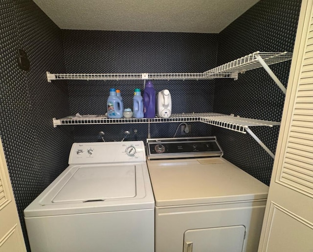 laundry area featuring washer and dryer and laundry area