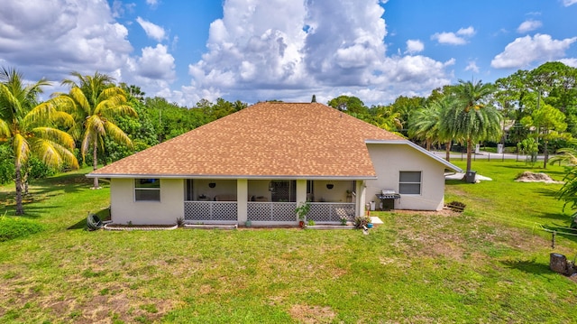 12820 87th St N, West Palm Beach, FL 33412 - back of house with a lawn, stucco siding, and a shingled roof