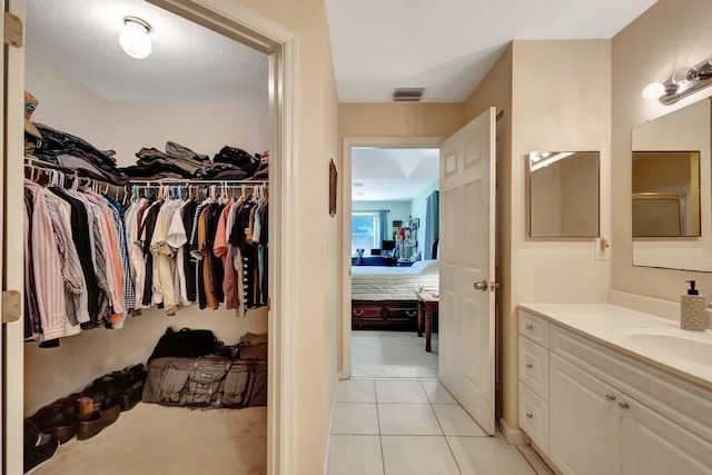 12820 87th St N, West Palm Beach, FL 33412 - walk in closet with a sink and light tile patterned flooring
