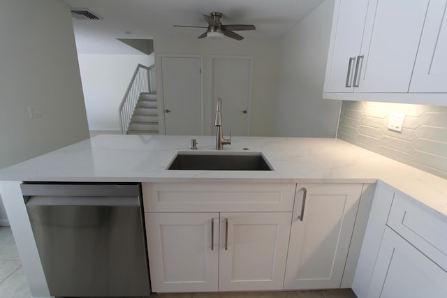 404 Live Oak Ln, Boynton Beach, FL 33436 - kitchen featuring backsplash, stainless steel dishwasher, white cabinets, and a sink