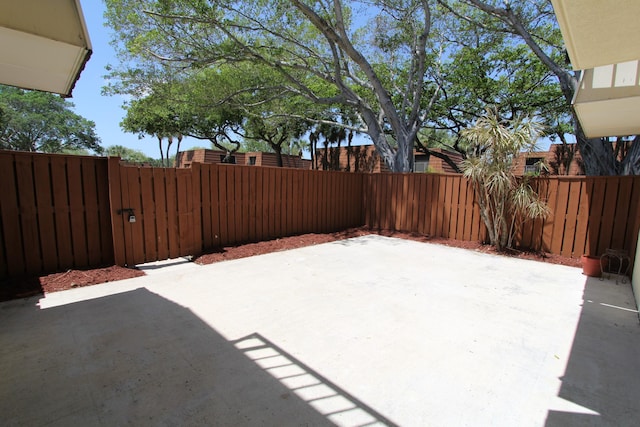404 Live Oak Ln, Boynton Beach, FL 33436 - view of patio with fence and a gate