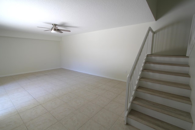 404 Live Oak Ln, Boynton Beach, FL 33436 - stairs featuring baseboards, a ceiling fan, and a textured ceiling