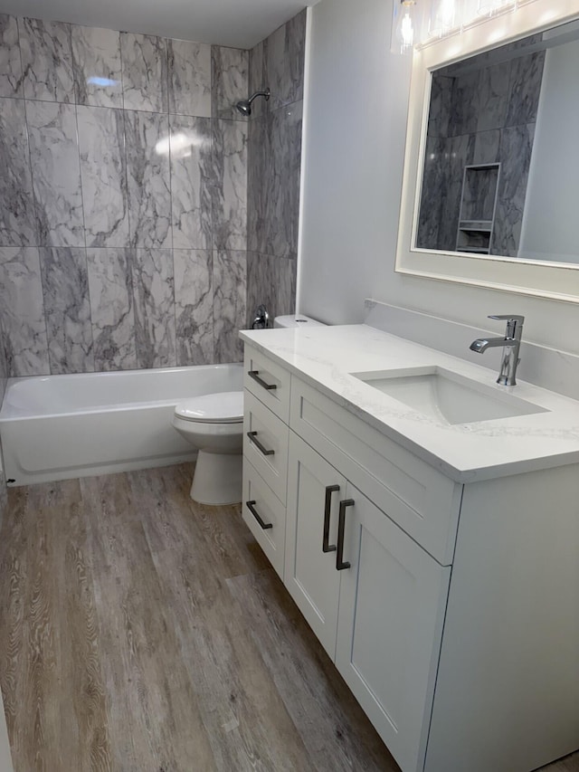 404 Live Oak Ln, Boynton Beach, FL 33436 - full bathroom featuring vanity, wood finished floors, and shower / bathtub combination