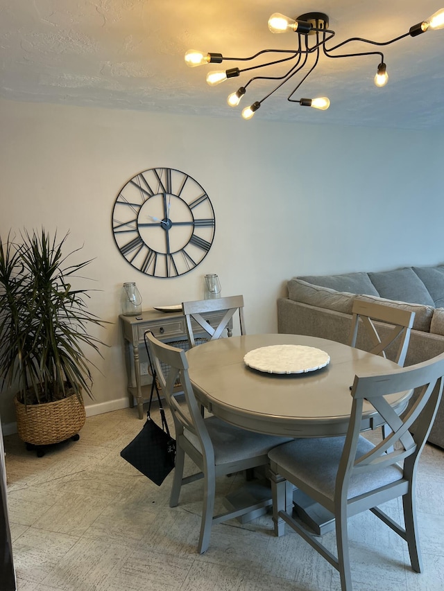 95 E E Ct, Royal Palm Beach, FL 33411 - dining room with a chandelier and baseboards