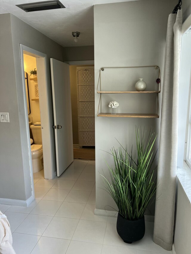 95 E E Ct, Royal Palm Beach, FL 33411 - bathroom featuring toilet and tile patterned floors