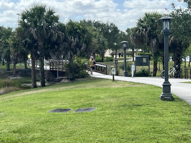 95 E E Ct, Royal Palm Beach, FL 33411 - view of property's community with a lawn