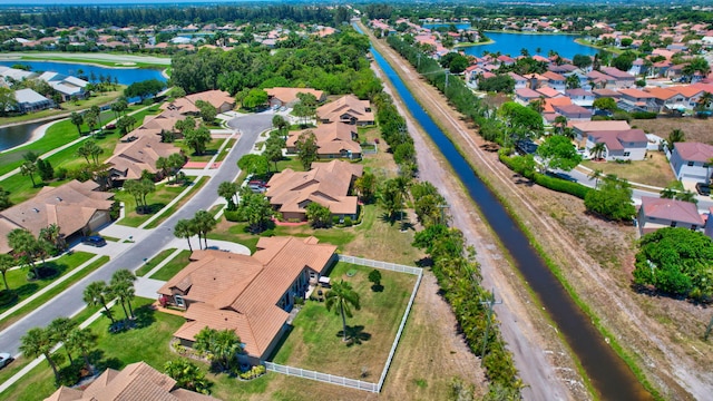 bird's eye view featuring a residential view and a water view