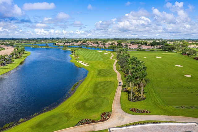 bird's eye view with a residential view, view of golf course, and a water view