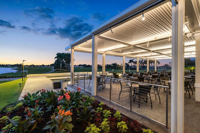 view of patio with a water view