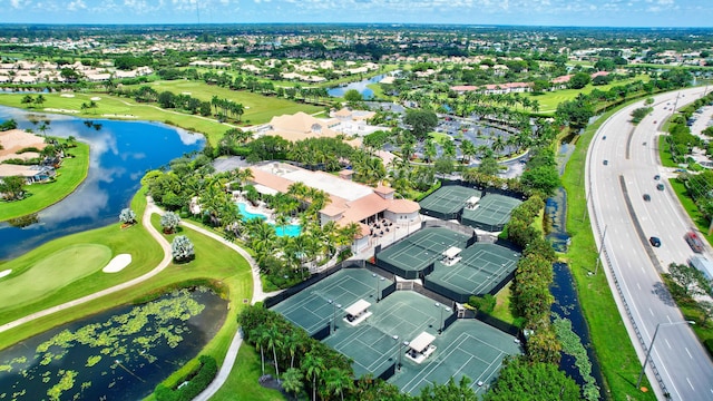 bird's eye view with a water view, golf course view, and a residential view